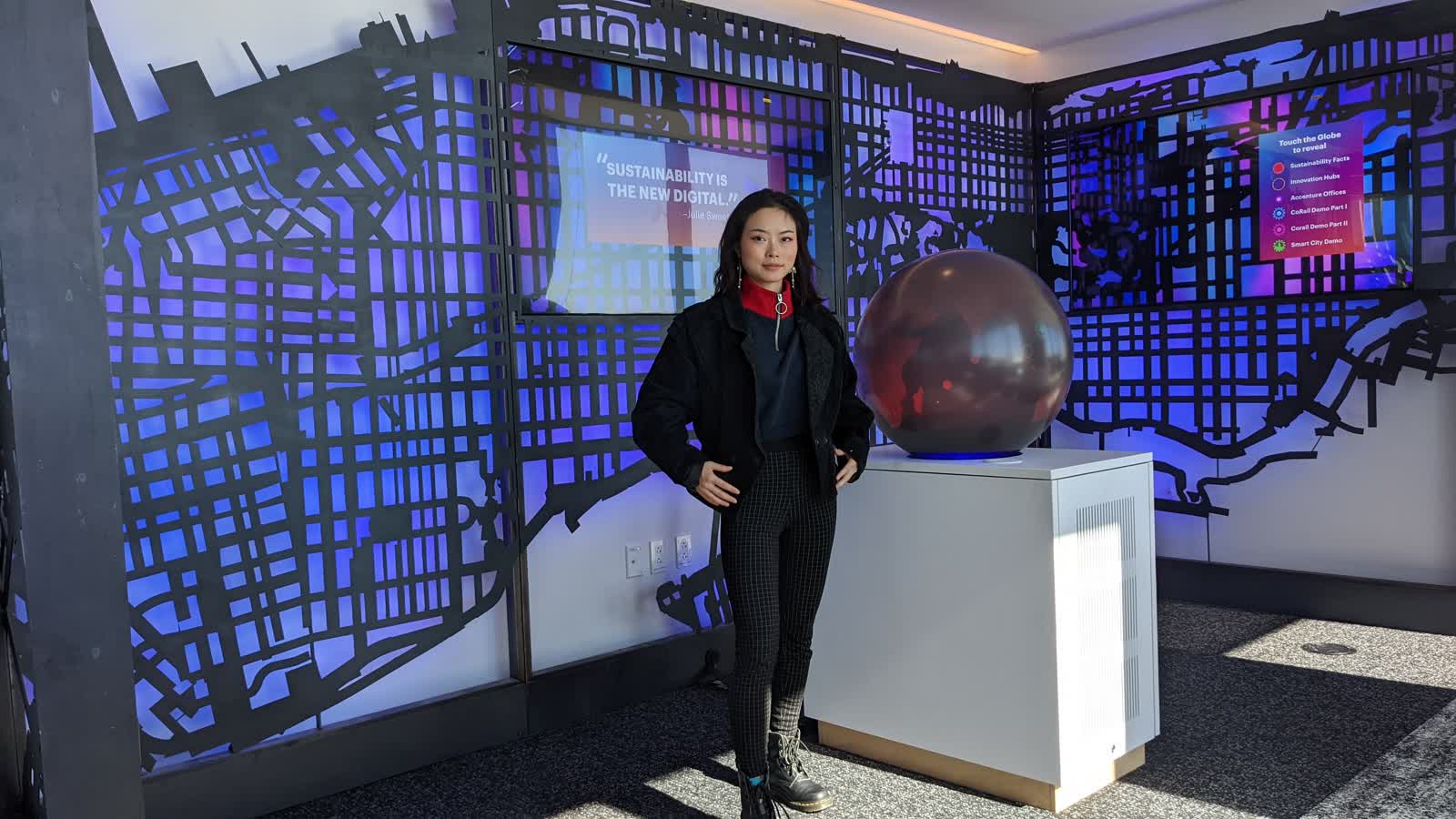 Yiting with the Smart Living globe and New York map installation