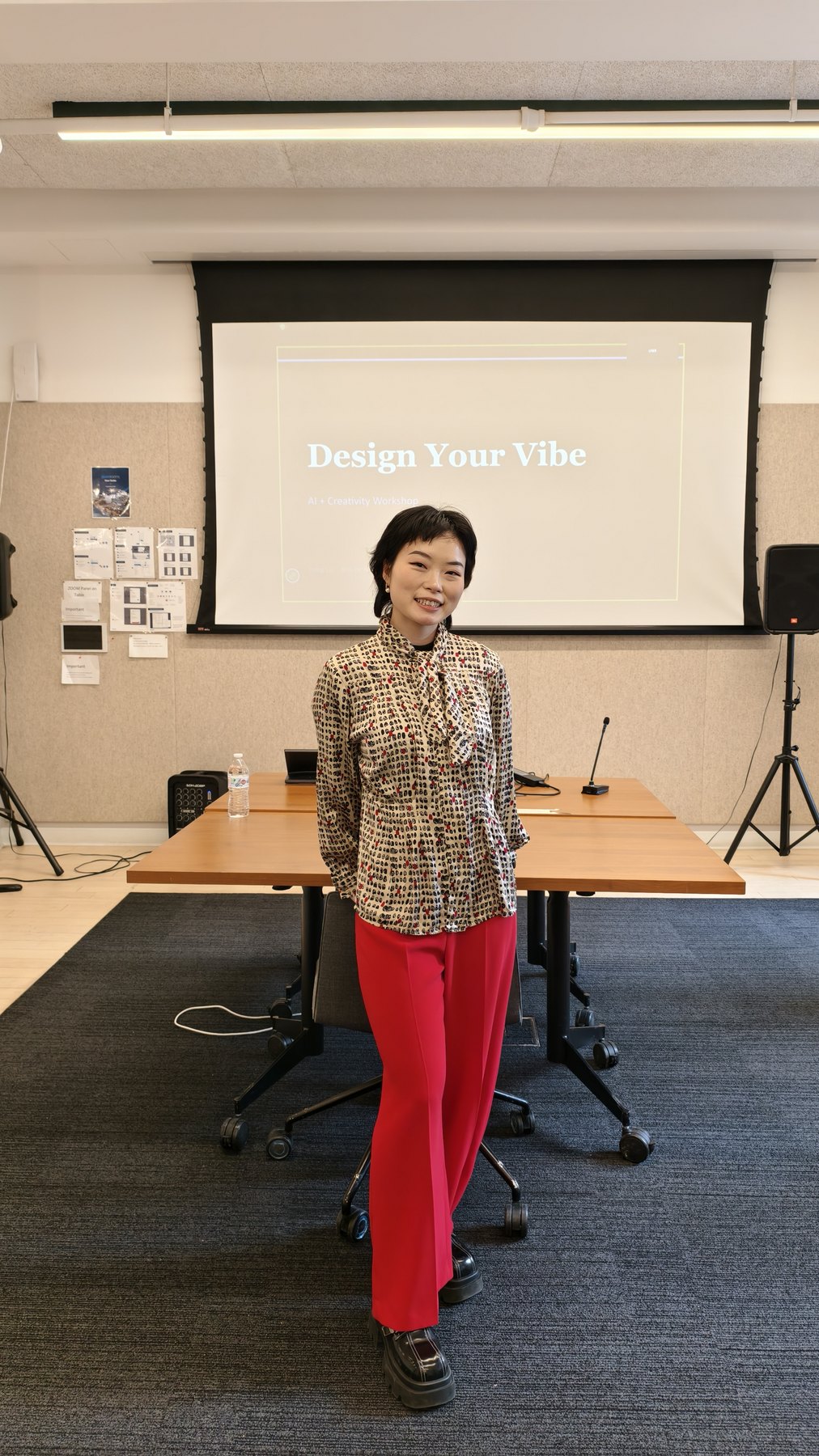 Yiting Liu standing in front of a Design Your Vibe AI and creativity workshop slide