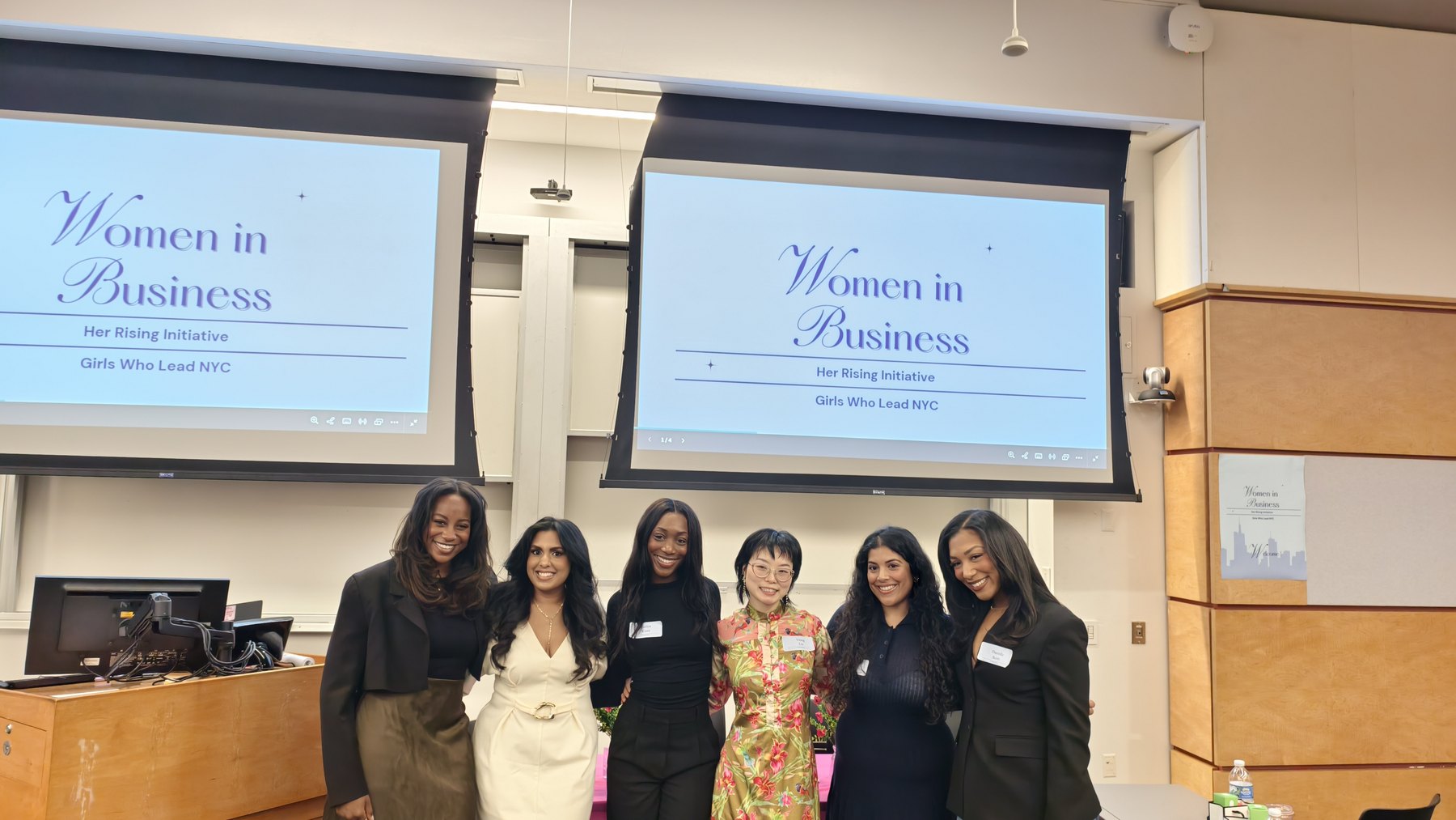 Yiting Liu with Her Rising and Girls Who Lead NYC speakers in front of Women in Business presentation screens